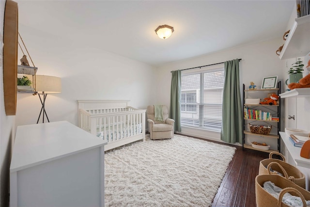 2230 S Piney Point Rd Unit 206, Houston, TX 77063 - bedroom with wood-type flooring and a nursery area