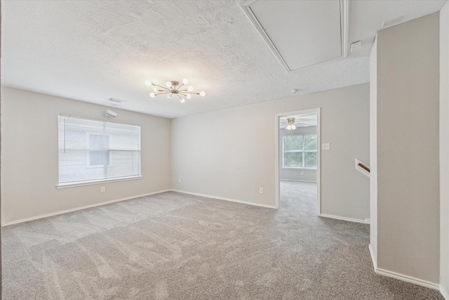 21619 Knightsbrook Ln, Katy, TX 77449 - empty room featuring attic access, carpet flooring, and a textured ceiling