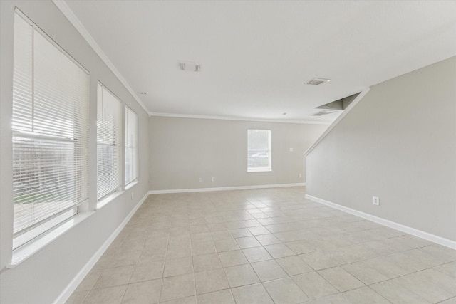 21619 Knightsbrook Ln, Katy, TX 77449 - empty room with healthy amount of natural light, light tile patterned floors, and ornamental molding