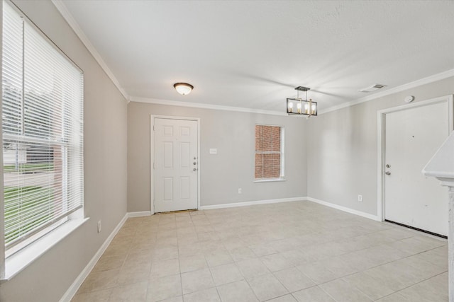 21619 Knightsbrook Ln, Katy, TX 77449 - entryway with plenty of natural light, a chandelier, ornamental molding, and light tile patterned flooring