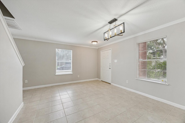 21619 Knightsbrook Ln, Katy, TX 77449 - empty room featuring healthy amount of natural light, ornamental molding, light tile patterned floors, and a textured ceiling