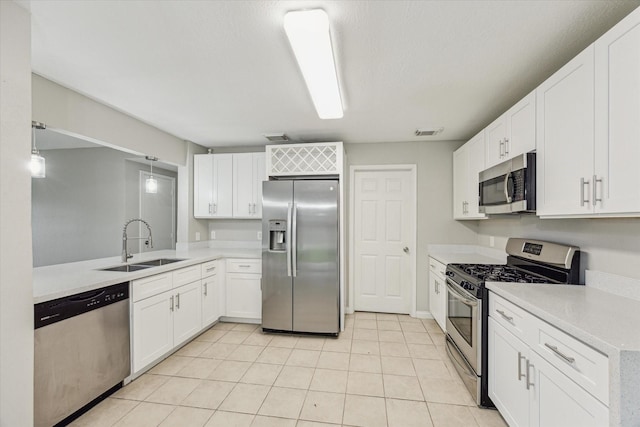 21619 Knightsbrook Ln, Katy, TX 77449 - kitchen with stainless steel appliances, light countertops, and white cabinetry