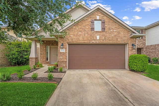 20726 Ranch Mill Ln, Cypress, TX 77433 - view of front of home with brick siding, concrete driveway, stucco siding, and a front lawn