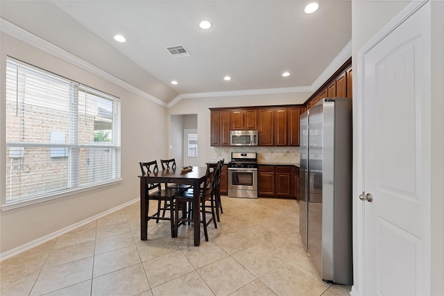 20726 Ranch Mill Ln, Cypress, TX 77433 - kitchen with appliances with stainless steel finishes, crown molding, tasteful backsplash, light tile patterned floors, and recessed lighting