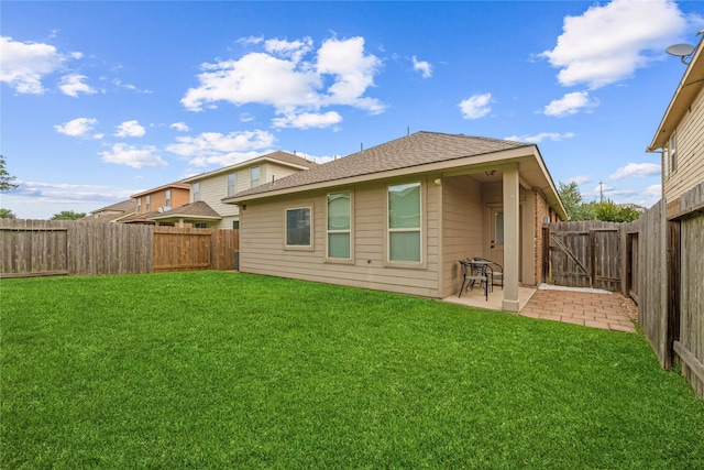 20726 Ranch Mill Ln, Cypress, TX 77433 - rear view of property with a fenced backyard, a patio area, roof with shingles, and a gate