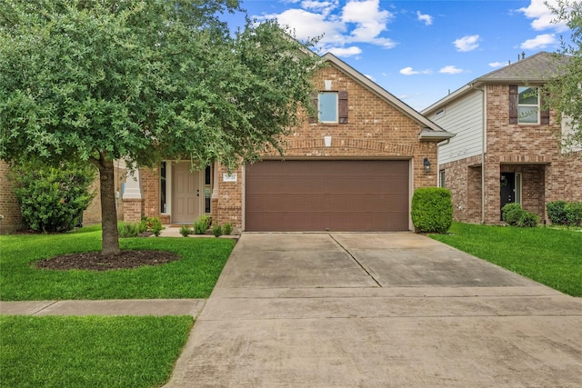 20726 Ranch Mill Ln, Cypress, TX 77433 - view of front of house with driveway, an attached garage, a front yard, and brick siding