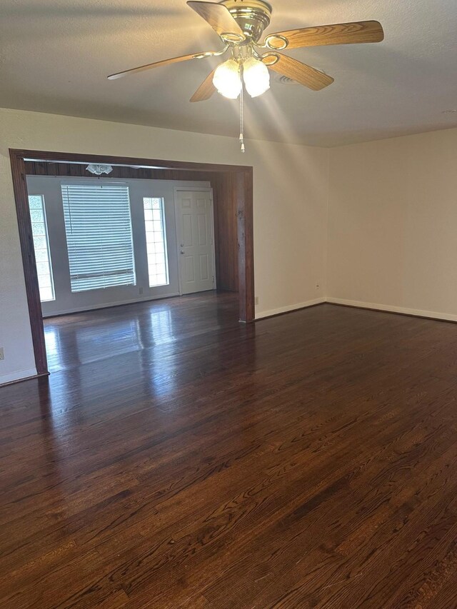 9337 Walterville Rd, Houston, TX 77080 - empty room with dark wood-style flooring and a ceiling fan
