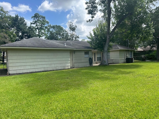 9337 Walterville Rd, Houston, TX 77080 - rear view of house with a yard