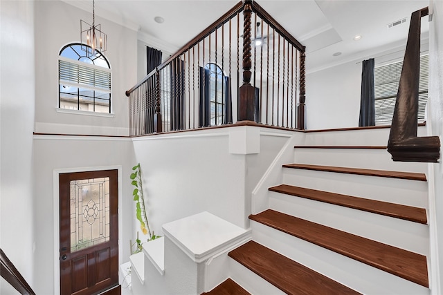 1320 Studer St, Houston, TX 77007 - stairway featuring ornamental molding, a chandelier, and a high ceiling