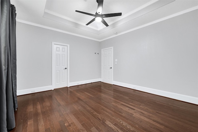 1320 Studer St, Houston, TX 77007 - spare room featuring a raised ceiling, dark wood finished floors, a ceiling fan, and crown molding