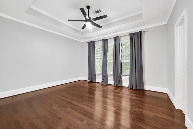 1320 Studer St, Houston, TX 77007 - spare room with a tray ceiling, wood finished floors, a ceiling fan, and ornamental molding