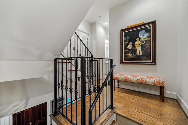 1126 Lake Pointe Pkwy, Sugar Land, TX 77478 - stairway featuring wood finished floors and recessed lighting