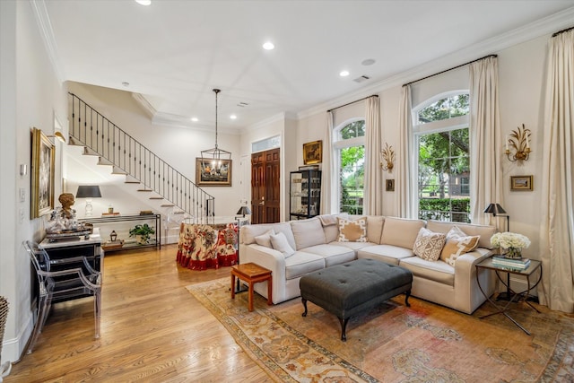 1126 Lake Pointe Pkwy, Sugar Land, TX 77478 - living room with stairs, recessed lighting, wood finished floors, and crown molding