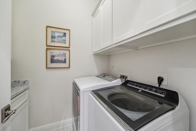 1126 Lake Pointe Pkwy, Sugar Land, TX 77478 - laundry area with washer and clothes dryer and cabinet space