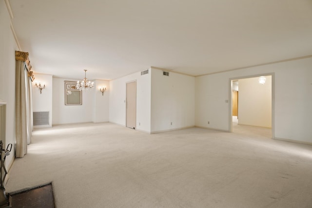 303 S Jackson St, Alvin, TX 77511 - spare room featuring light carpet and a chandelier