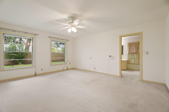 303 S Jackson St, Alvin, TX 77511 - unfurnished room featuring light colored carpet and a ceiling fan
