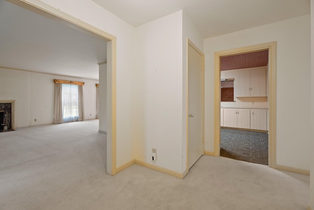 303 S Jackson St, Alvin, TX 77511 - hallway with carpet floors and baseboards
