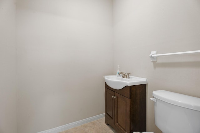 303 S Jackson St, Alvin, TX 77511 - half bathroom featuring vanity and tile patterned floors