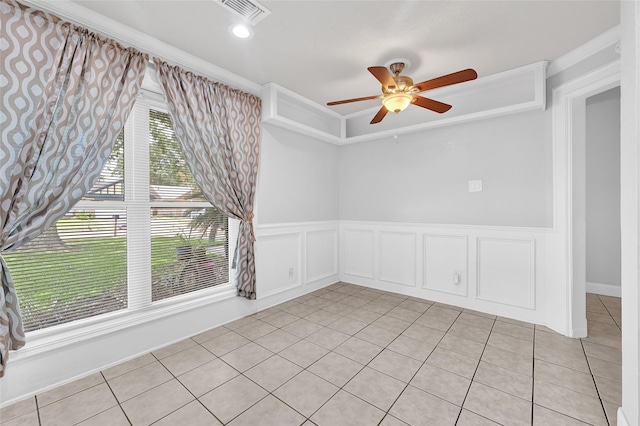 20042 S Pecos Valley Trl, Katy, TX 77449 - spare room featuring ceiling fan, light tile patterned flooring, a wainscoted wall, and crown molding