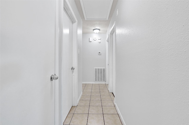 20042 S Pecos Valley Trl, Katy, TX 77449 - corridor with light tile patterned floors and a textured ceiling