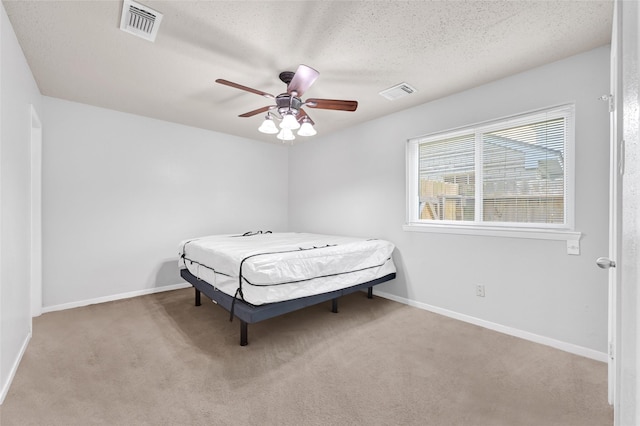 20042 S Pecos Valley Trl, Katy, TX 77449 - bedroom with carpet floors, a textured ceiling, and a ceiling fan