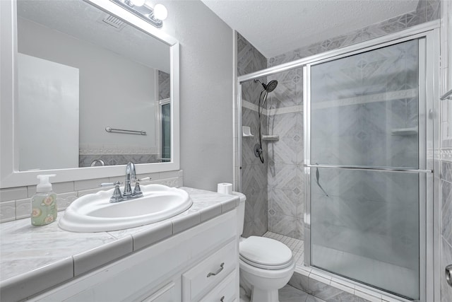 20042 S Pecos Valley Trl, Katy, TX 77449 - full bathroom with a shower stall, vanity, and a textured ceiling