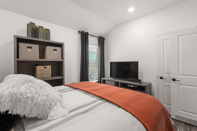 3051 Newcastle Crest Ln, Dickinson, TX 77539 - bedroom featuring vaulted ceiling and wood finished floors