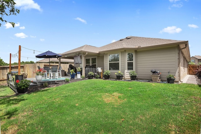 3051 Newcastle Crest Ln, Dickinson, TX 77539 - rear view of property with a fenced backyard, a patio, and a shingled roof