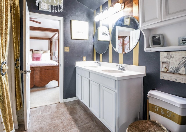 4723 Peninsula Garden Way, Humble, TX 77396 - ensuite bathroom with a textured wall and double vanity