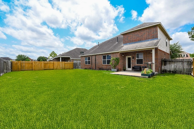 4723 Peninsula Garden Way, Humble, TX 77396 - back of house featuring a patio, a fenced backyard, and brick siding
