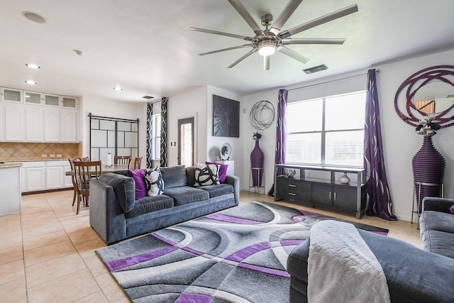 4723 Peninsula Garden Way, Humble, TX 77396 - living room featuring light tile patterned flooring, a ceiling fan, and recessed lighting