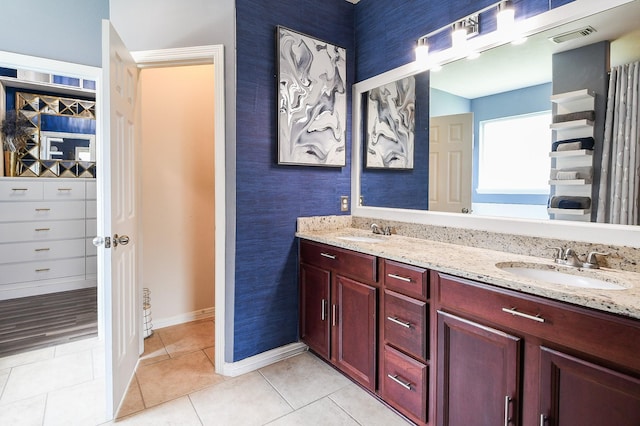 4723 Peninsula Garden Way, Humble, TX 77396 - bathroom featuring double vanity, tile patterned floors, and wallpapered walls