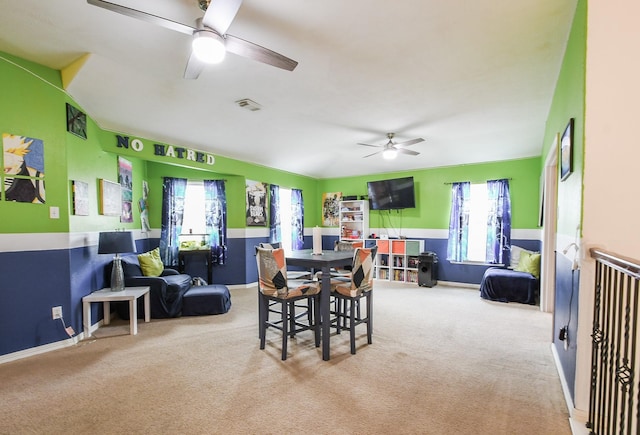 4723 Peninsula Garden Way, Humble, TX 77396 - dining area featuring ceiling fan and carpet floors