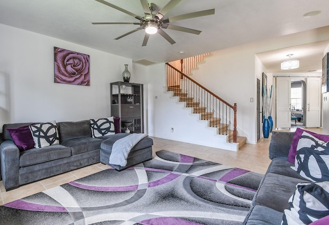 4723 Peninsula Garden Way, Humble, TX 77396 - living area featuring stairs, tile patterned floors, and ceiling fan