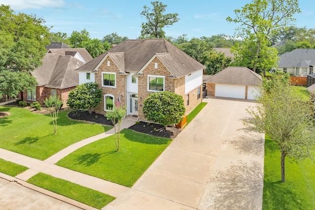 114 Arrowhead Dr, Lake Jackson, TX 77566 - view of front of house with brick siding, an outdoor structure, a front yard, a garage, and concrete driveway