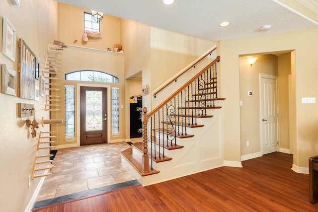 114 Arrowhead Dr, Lake Jackson, TX 77566 - foyer with wood finished floors, plenty of natural light, stairs, and recessed lighting