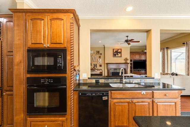114 Arrowhead Dr, Lake Jackson, TX 77566 - kitchen with black appliances, open floor plan, ceiling fan, crown molding, and brown cabinets