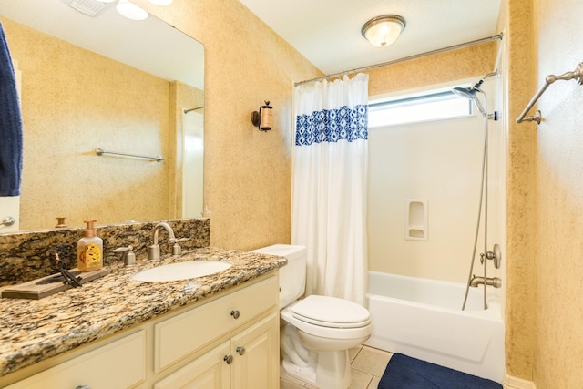 114 Arrowhead Dr, Lake Jackson, TX 77566 - bathroom featuring vanity, shower / tub combo, tile patterned floors, and a textured wall