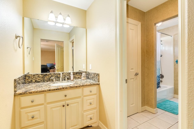 114 Arrowhead Dr, Lake Jackson, TX 77566 - bathroom featuring vanity, tile patterned floors, and shower / tub combination