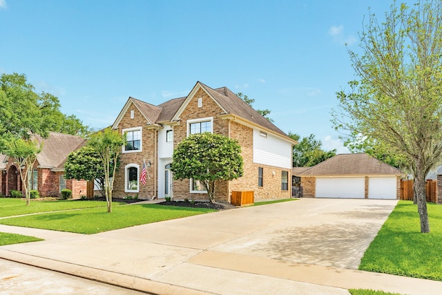 114 Arrowhead Dr, Lake Jackson, TX 77566 - traditional home featuring brick siding, a detached garage, and an outbuilding