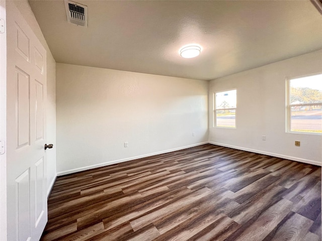 2328 Wimcrest St, Galveston, TX 77551 - spare room featuring baseboards and dark wood-style flooring
