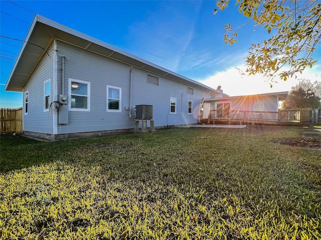 2328 Wimcrest St, Galveston, TX 77551 - rear view of property with a yard and a wooden deck
