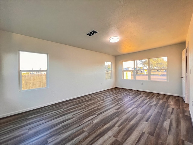 2328 Wimcrest St, Galveston, TX 77551 - empty room featuring dark wood-style flooring and baseboards