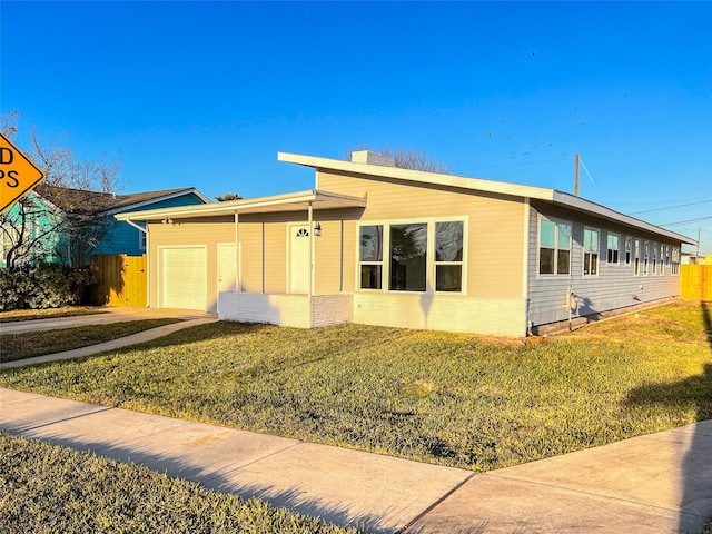 2328 Wimcrest St, Galveston, TX 77551 - ranch-style home featuring an attached garage, driveway, and brick siding
