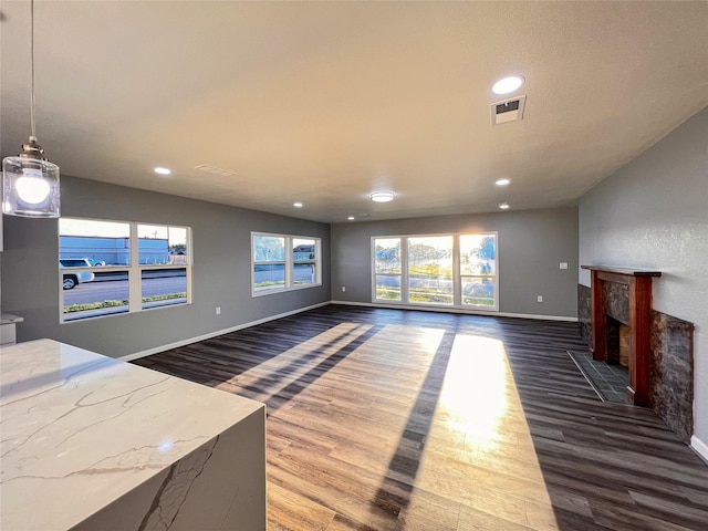 2328 Wimcrest St, Galveston, TX 77551 - unfurnished living room featuring wood finished floors, recessed lighting, and a fireplace with flush hearth