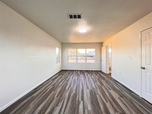 2328 Wimcrest St, Galveston, TX 77551 - spare room with baseboards and dark wood-type flooring