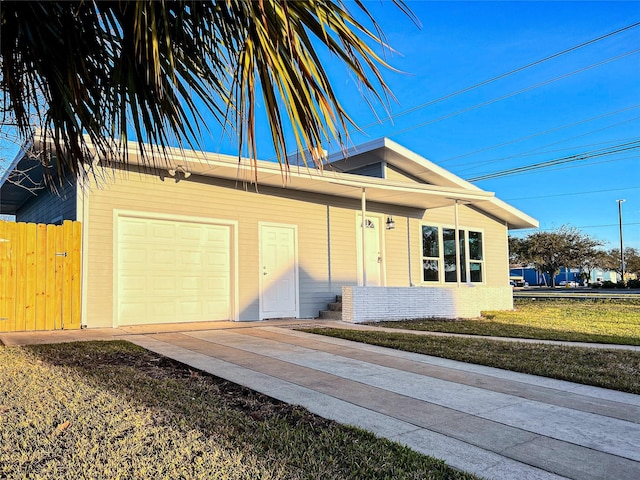 2328 Wimcrest St, Galveston, TX 77551 - view of front of home with concrete driveway and covered porch