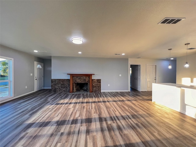 2328 Wimcrest St, Galveston, TX 77551 - unfurnished living room with wood finished floors, a fireplace, and recessed lighting