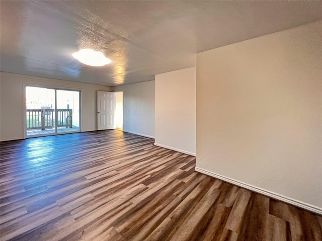 2328 Wimcrest St, Galveston, TX 77551 - empty room with dark wood-type flooring and baseboards