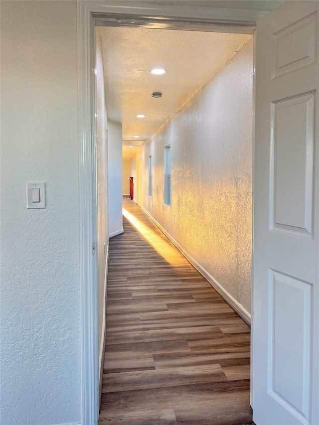 2328 Wimcrest St, Galveston, TX 77551 - hallway with wood finished floors, a textured wall, and recessed lighting